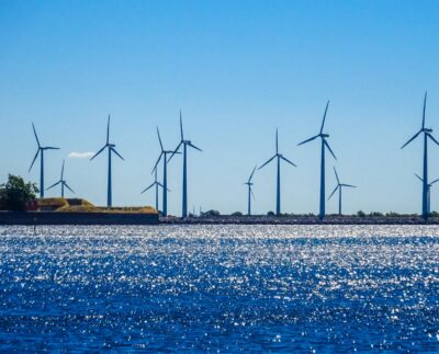 Photo by Nico : https://www.pexels.com/photo/wind-farm-on-sea-shore-7019037/