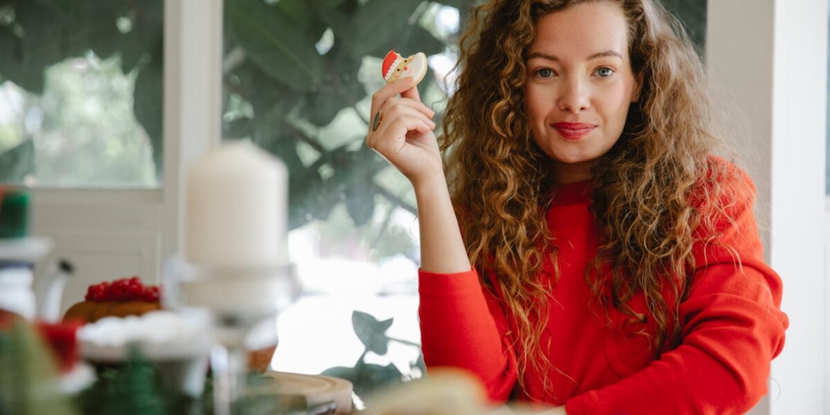 Photo by Tim Douglas : https://www.pexels.com/photo/content-woman-with-cookie-in-hand-6210707/