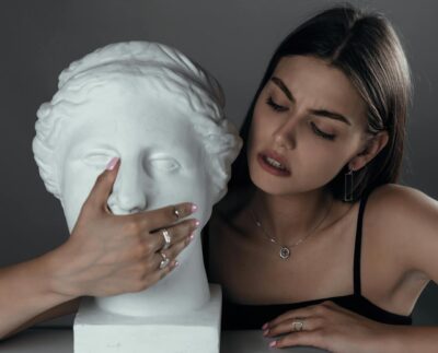 Photo by Elijah O'Donnell: https://www.pexels.com/photo/young-woman-with-bust-sculpture-5022459/