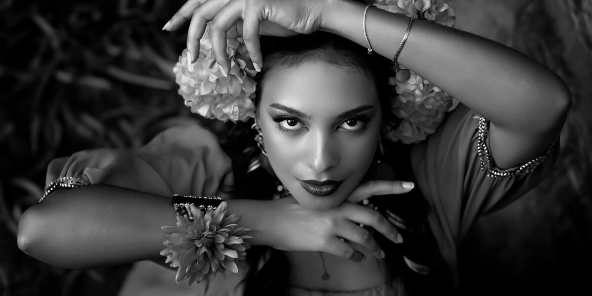 Photo by Pedro Dias: https://www.pexels.com/photo/a-woman-in-a-black-and-white-photo-with-flowers-27820541/