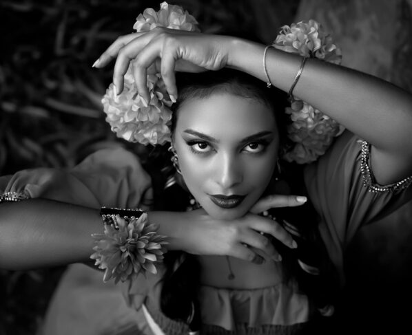 Photo by Pedro Dias: https://www.pexels.com/photo/a-woman-in-a-black-and-white-photo-with-flowers-27820541/