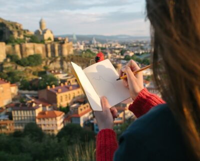 Photo by ArtHouse Studio: https://www.pexels.com/photo/photo-of-person-holding-notebook-and-pen-4638275/