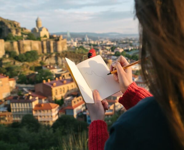Photo by ArtHouse Studio: https://www.pexels.com/photo/photo-of-person-holding-notebook-and-pen-4638275/
