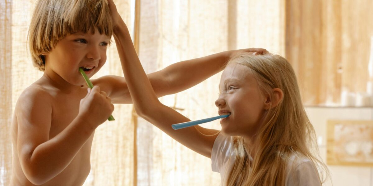 Photo by cottonbro studio: https://www.pexels.com/photo/brother-and-sister-brushing-their-teeth-7086237/