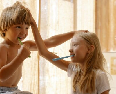 Photo by cottonbro studio: https://www.pexels.com/photo/brother-and-sister-brushing-their-teeth-7086237/