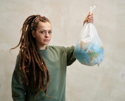 Photo by Julia M Cameron: https://www.pexels.com/photo/a-woman-holding-a-globe-in-a-plastic-6995299/