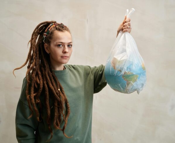 Photo by Julia M Cameron: https://www.pexels.com/photo/a-woman-holding-a-globe-in-a-plastic-6995299/