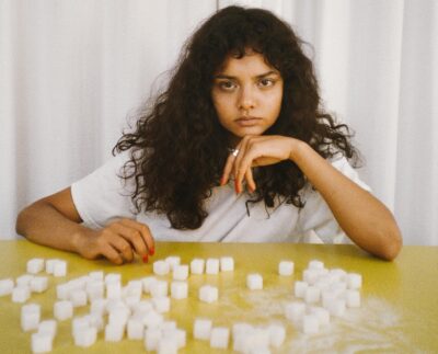 Photo by Polina Tankilevitch: https://www.pexels.com/photo/woman-leaning-on-a-table-with-sugar-cubes-5469304/