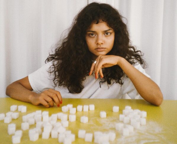 Photo by Polina Tankilevitch: https://www.pexels.com/photo/woman-leaning-on-a-table-with-sugar-cubes-5469304/