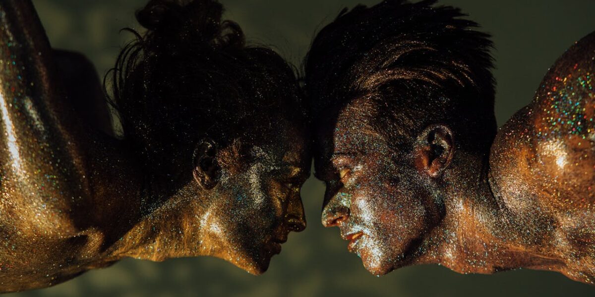 Photo by KoolShooters : https://www.pexels.com/photo/a-man-and-woman-covered-with-glitters-7694441/
