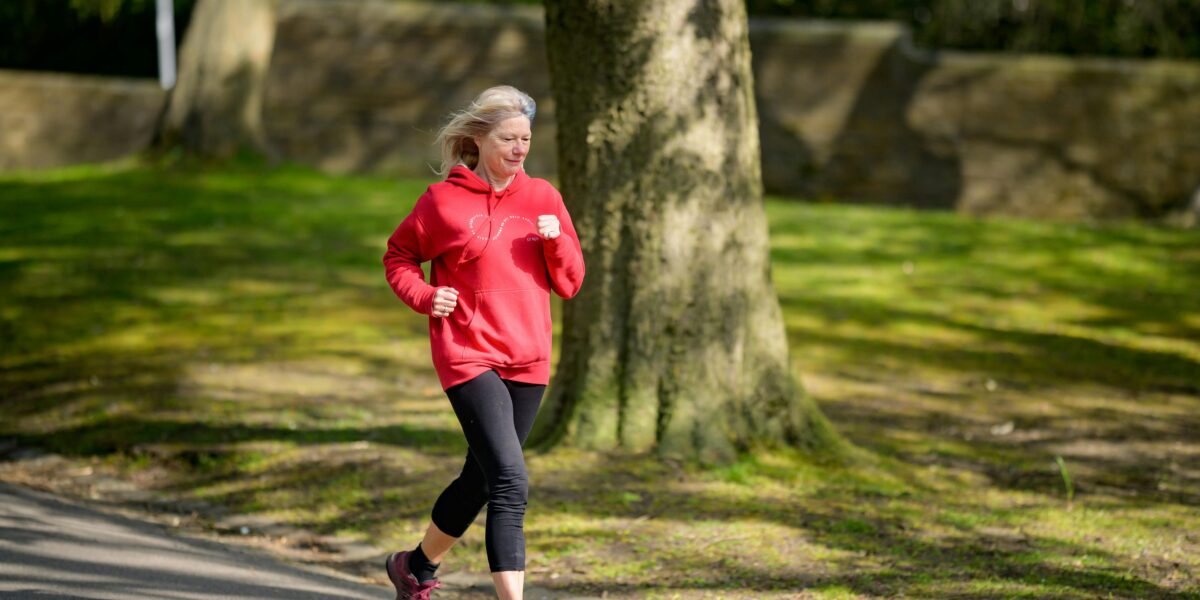 Photo by Centre for Ageing Better: https://www.pexels.com/photo/girl-in-red-hoodie-and-black-leggings-jogging-7849902/