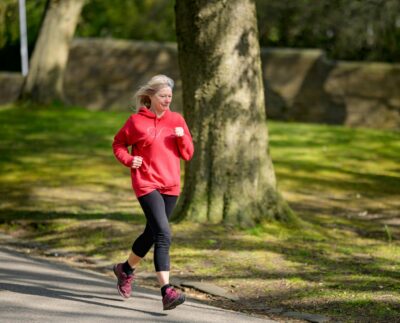 Photo by Centre for Ageing Better: https://www.pexels.com/photo/girl-in-red-hoodie-and-black-leggings-jogging-7849902/