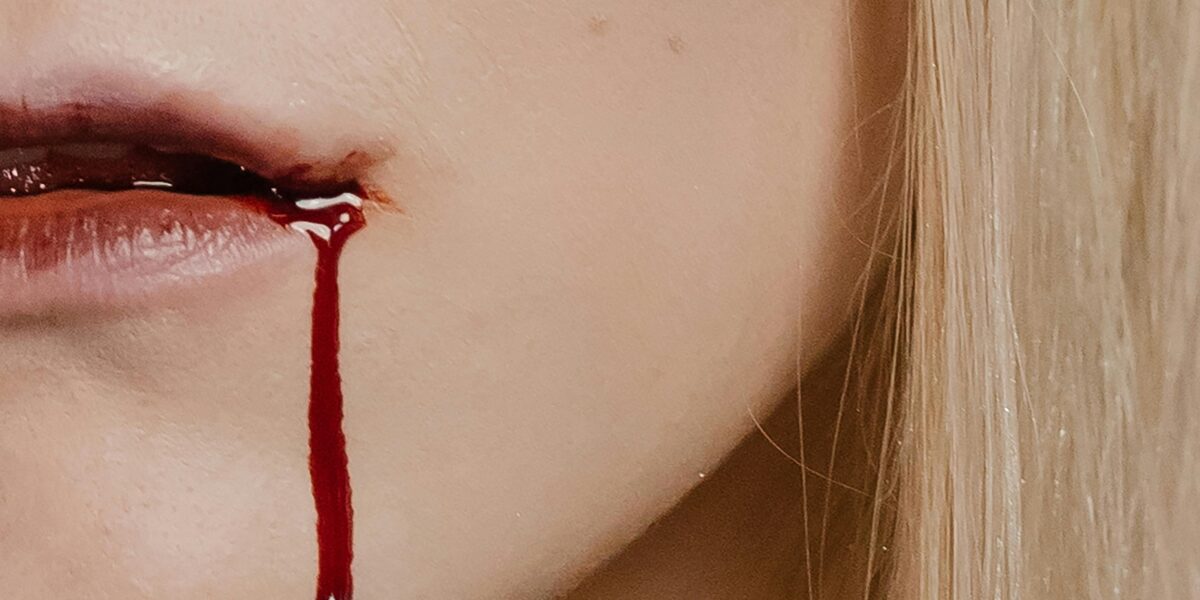 Photo by cottonbro studio: https://www.pexels.com/photo/a-woman-with-dripping-blood-on-her-mouth-5546478/
