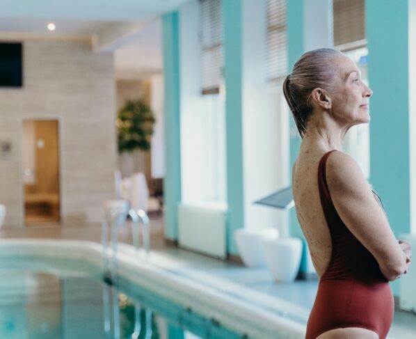 Photo by cottonbro studio: https://www.pexels.com/photo/side-view-of-an-elderly-woman-in-maroon-swimwear-7224448/