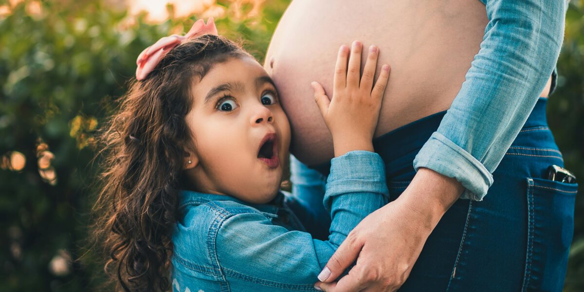 Photo by Daniel Duarte: https://www.pexels.com/photo/girl-touching-the-pregnant-belly-of-her-mother-15797917/