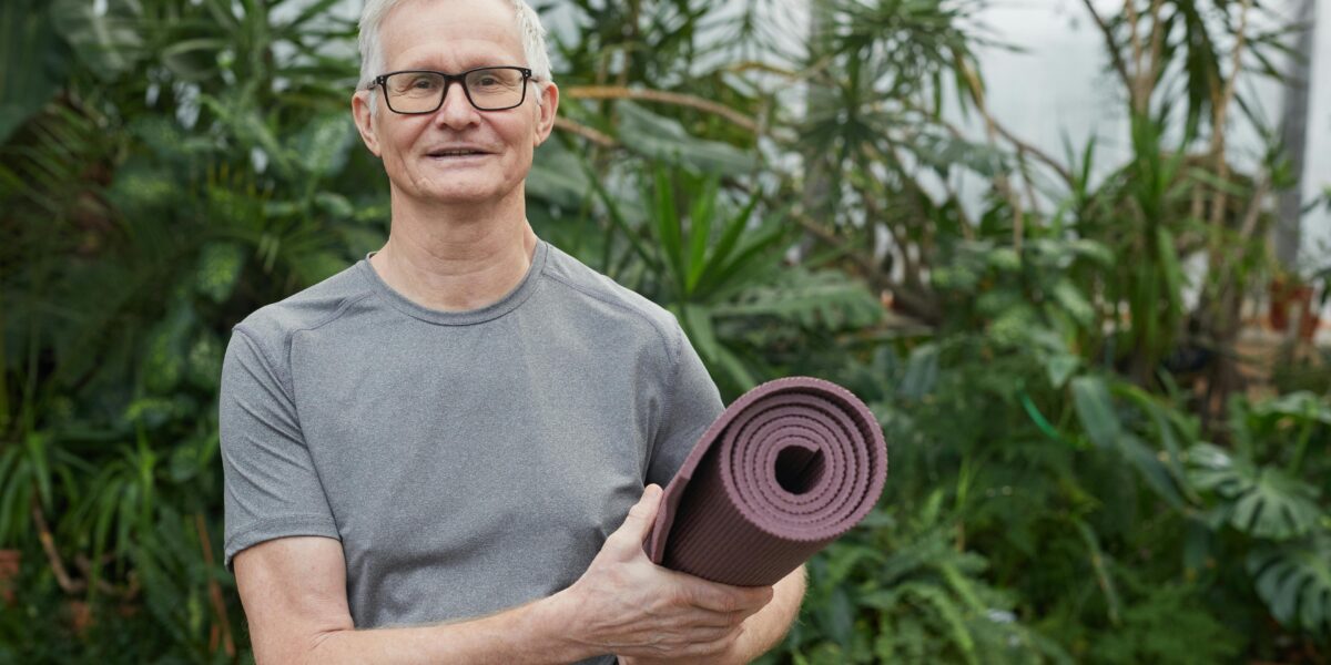 Photo by Marcus Aurelius: https://www.pexels.com/photo/man-standing-while-holding-a-yoga-mat-6787548/