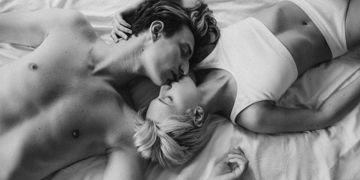 Photo by cottonbro studio: https://www.pexels.com/photo/grayscale-photo-of-a-romantic-couple-kissing-on-the-bed-9374660/