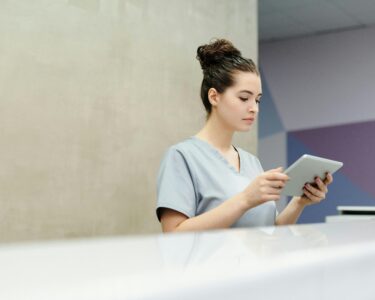Photo by Cedric Fauntleroy: https://www.pexels.com/photo/a-receptionist-looking-at-a-tablet-4269275/