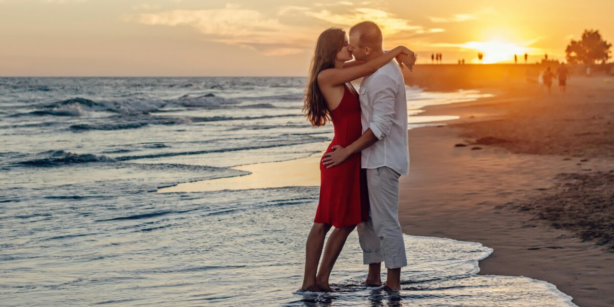 Photo by Summer Stock: https://www.pexels.com/photo/couple-kissing-on-beach-during-golden-hour-285938/