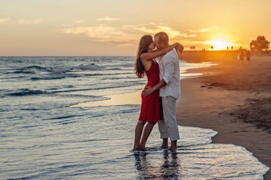 Photo by Summer Stock: https://www.pexels.com/photo/couple-kissing-on-beach-during-golden-hour-285938/