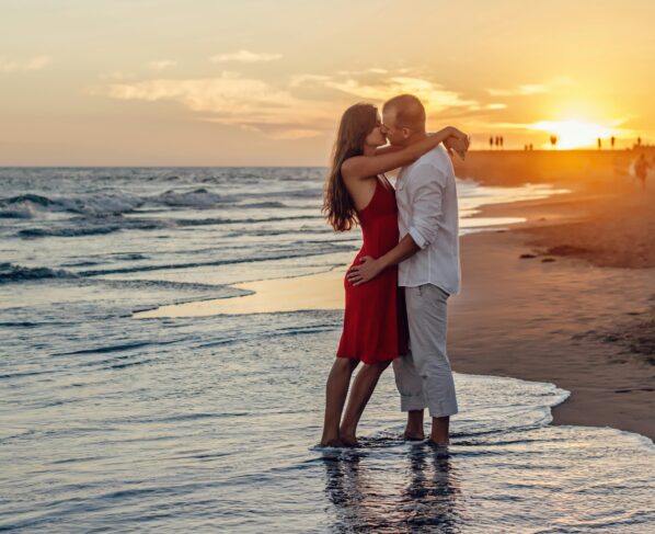 Photo by Summer Stock: https://www.pexels.com/photo/couple-kissing-on-beach-during-golden-hour-285938/