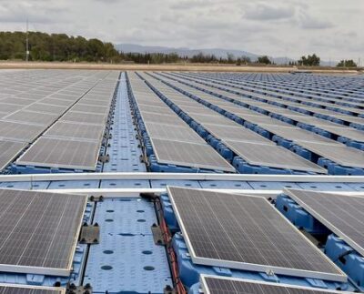 Mike Popp, Harold F. Ohlendorf Professor of agricultural economics and agribusiness for the University of Arkansas System Division of Agriculture and the Dale Bumpers College of Agricultural, Food and Life Sciences, stands on a floating solar array in Spain.