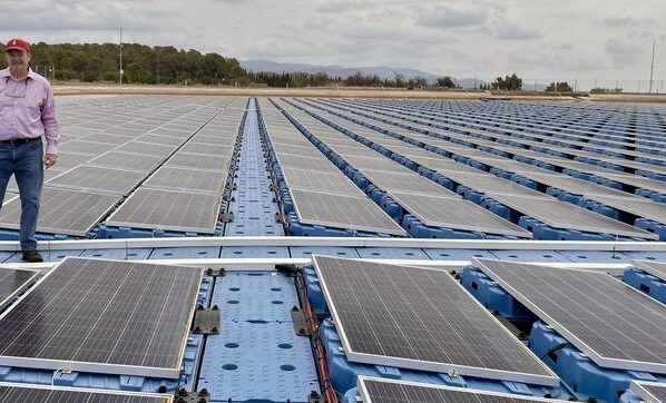Mike Popp, Harold F. Ohlendorf Professor of agricultural economics and agribusiness for the University of Arkansas System Division of Agriculture and the Dale Bumpers College of Agricultural, Food and Life Sciences, stands on a floating solar array in Spain.