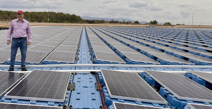 Mike Popp, Harold F. Ohlendorf Professor of agricultural economics and agribusiness for the University of Arkansas System Division of Agriculture and the Dale Bumpers College of Agricultural, Food and Life Sciences, stands on a floating solar array in Spain.