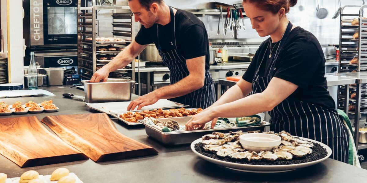 Photo by Elle Hughes: https://www.pexels.com/photo/man-and-woman-wearing-black-and-white-striped-aprons-cooking-2696064/