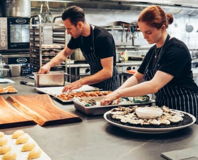 Photo by Elle Hughes: https://www.pexels.com/photo/man-and-woman-wearing-black-and-white-striped-aprons-cooking-2696064/