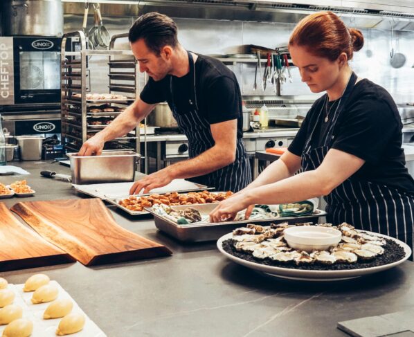 Photo by Elle Hughes: https://www.pexels.com/photo/man-and-woman-wearing-black-and-white-striped-aprons-cooking-2696064/