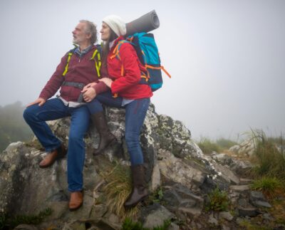 Photo by Kampus Production: https://www.pexels.com/photo/couple-in-backpacks-sitting-on-gray-rock-formation-7787436/
