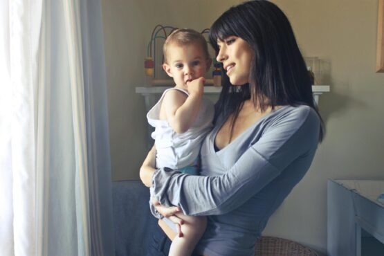Photo by Andrea Piacquadio: https://www.pexels.com/photo/mother-carrying-her-baby-boy-755028/
