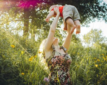 Photo by Creation Hill: https://www.pexels.com/photo/mother-lifting-her-baby-1261909/