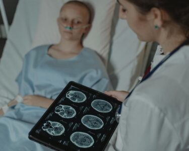 Photo by Tima Miroshnichenko: https://www.pexels.com/photo/doctor-looking-at-ct-scan-result-6011602/
