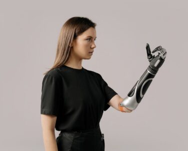 Photo by cottonbro studio: https://www.pexels.com/photo/a-woman-with-a-prosthetic-arm-6153070/