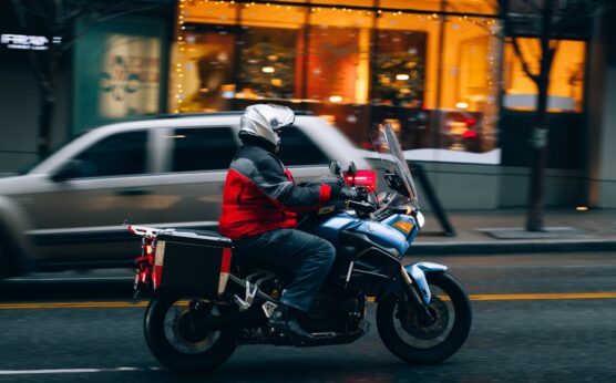 Photo by Josh Hild: https://www.pexels.com/photo/motorcyclist-riding-through-seattle-street-30167817/