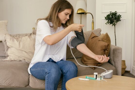 Photo by Mikhail Nilov: https://www.pexels.com/photo/a-woman-in-white-shirt-checking-her-blood-pressure-8670518/