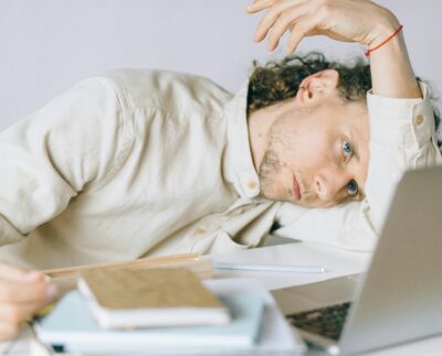 Photo by Nataliya Vaitkevich: https://www.pexels.com/photo/overworked-employee-lying-in-front-of-laptop-6837648/