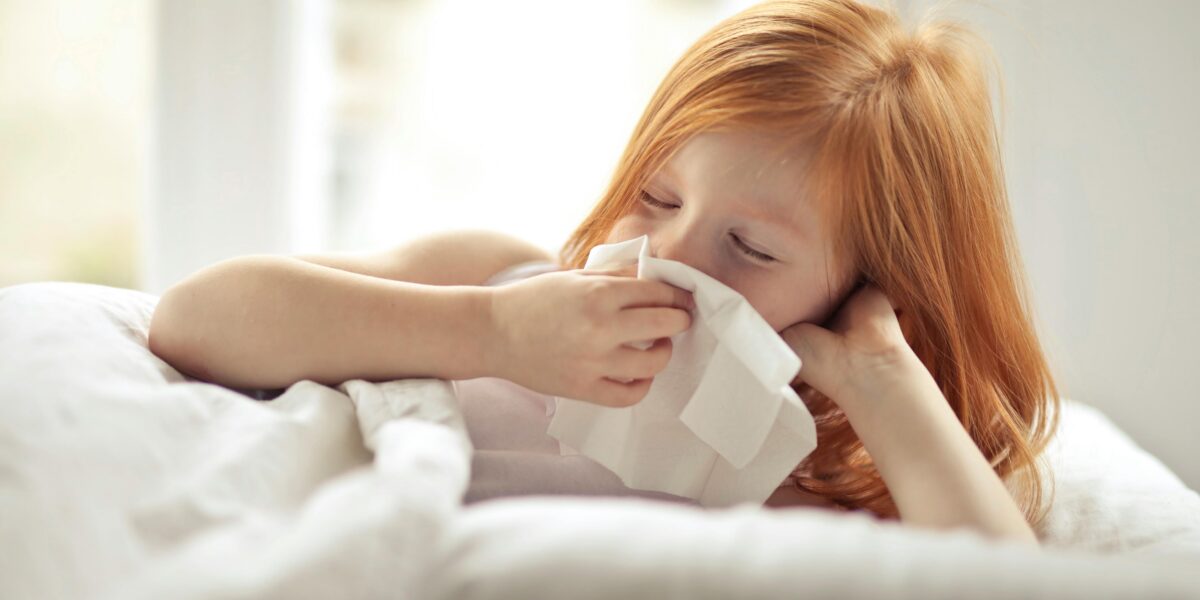 Photo by Andrea Piacquadio: https://www.pexels.com/photo/a-sick-girl-wiping-her-nose-with-tissue-3765115/