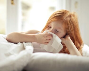 Photo by Andrea Piacquadio: https://www.pexels.com/photo/a-sick-girl-wiping-her-nose-with-tissue-3765115/