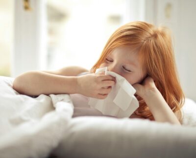 Photo by Andrea Piacquadio: https://www.pexels.com/photo/a-sick-girl-wiping-her-nose-with-tissue-3765115/