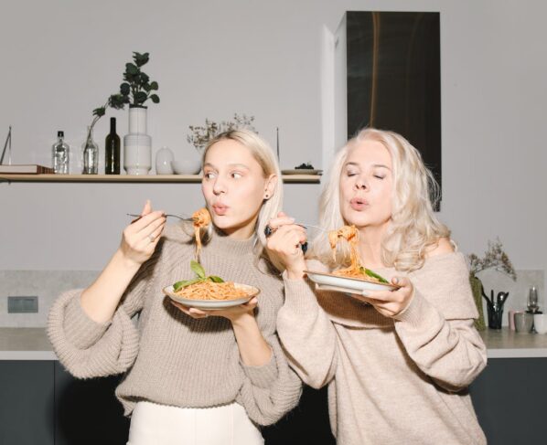 Photo by Polina Tankilevitch: https://www.pexels.com/photo/mother-and-daughter-eating-spaghetti-6073642/