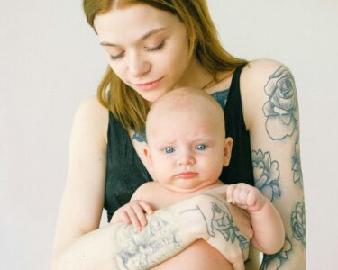 Photo by Anna Shvets: https://www.pexels.com/photo/tattooed-mother-carrying-her-cute-baby-3845171/