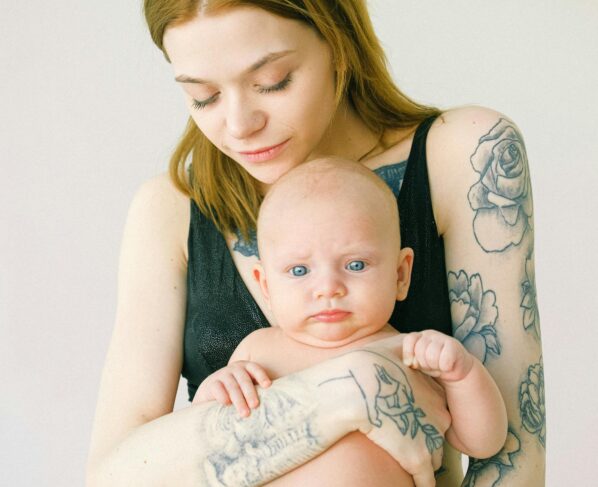 Photo by Anna Shvets: https://www.pexels.com/photo/tattooed-mother-carrying-her-cute-baby-3845171/