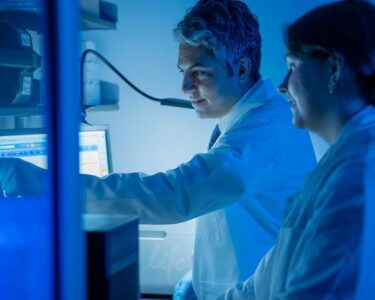 Elias Sayour (left) works in the lab. UF Health, Jackie Hart