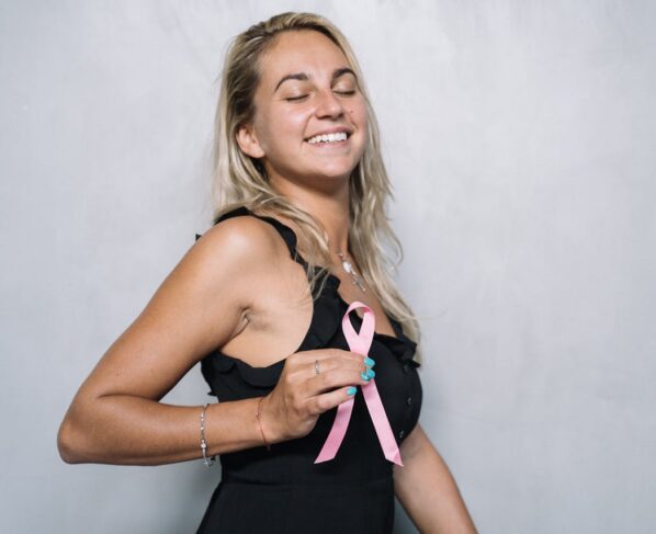 Photo by Anna Tarazevich: https://www.pexels.com/photo/woman-in-black-spaghetti-strap-top-holding-pink-ribbon-5483016/
