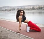 Photo by Andrea Piacquadio: https://www.pexels.com/photo/selective-focus-photo-of-woman-in-black-sports-bra-and-red-leggings-stretching-near-body-of-water-3764564/