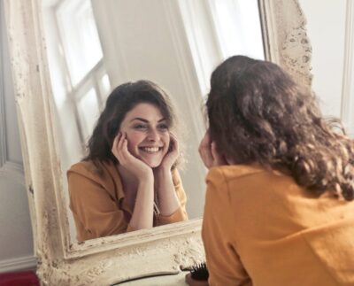 Photo by Andrea Piacquadio: https://www.pexels.com/photo/photo-of-woman-looking-at-the-mirror-774866/