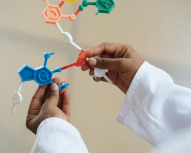 Photo by RF._.studio _: https://www.pexels.com/photo/crop-chemist-holding-in-hands-molecule-model-3825527/